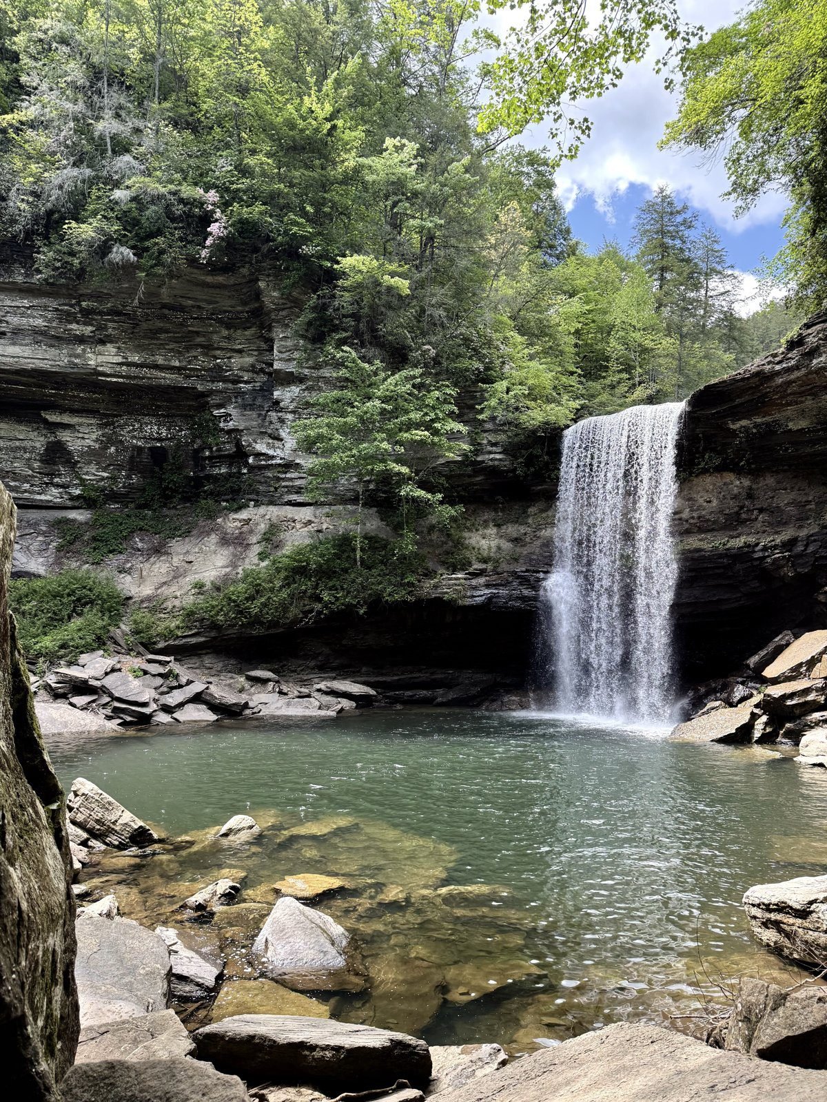 Lower Greeter Falls and its plunge pool under a blue sky, Tennessee